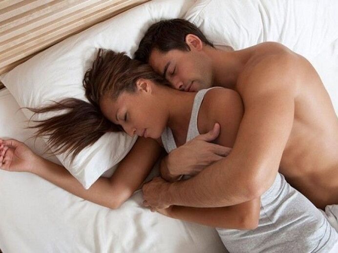 a woman in bed with a man who has strengthened power